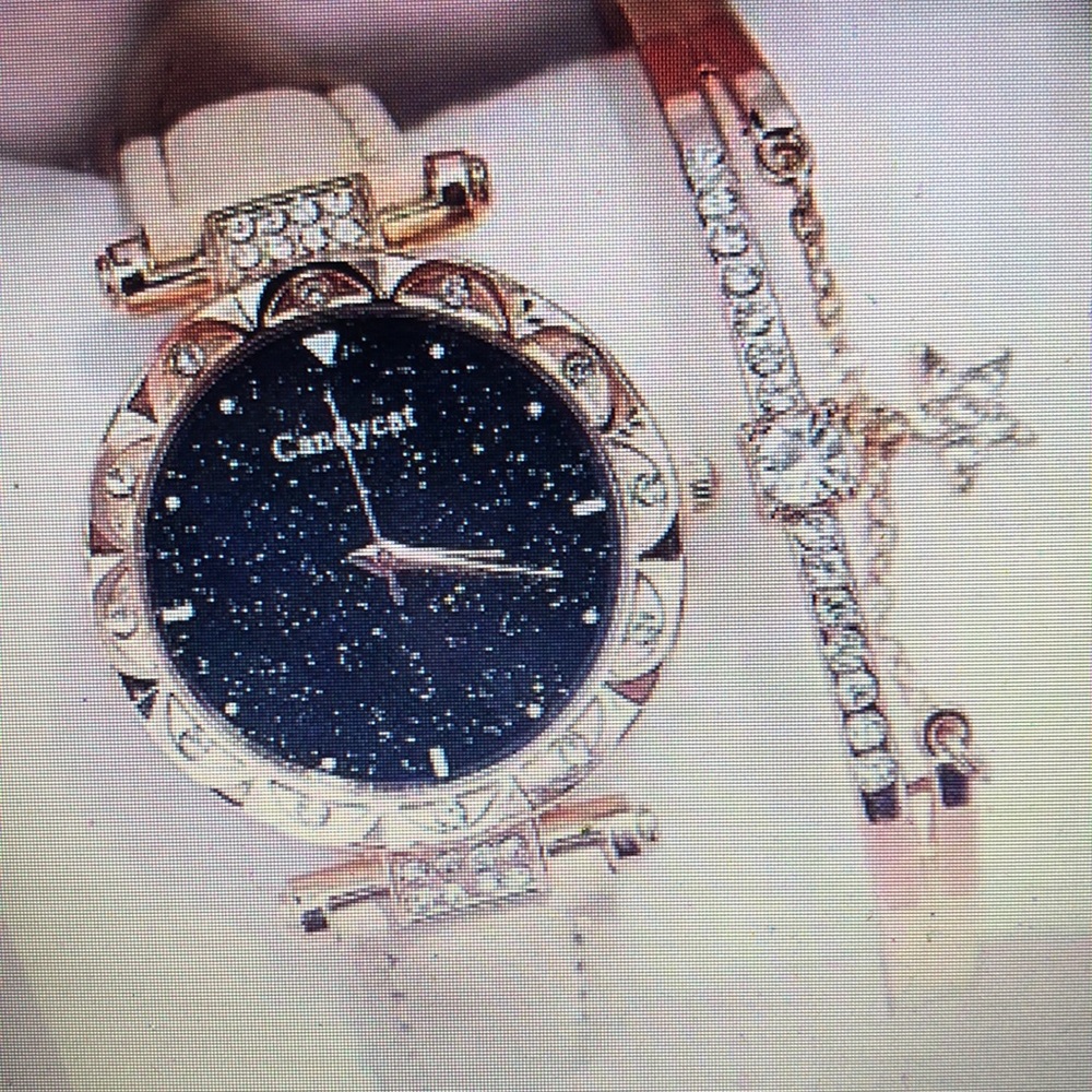 Round quartz watch and rose gold bangle bracelet